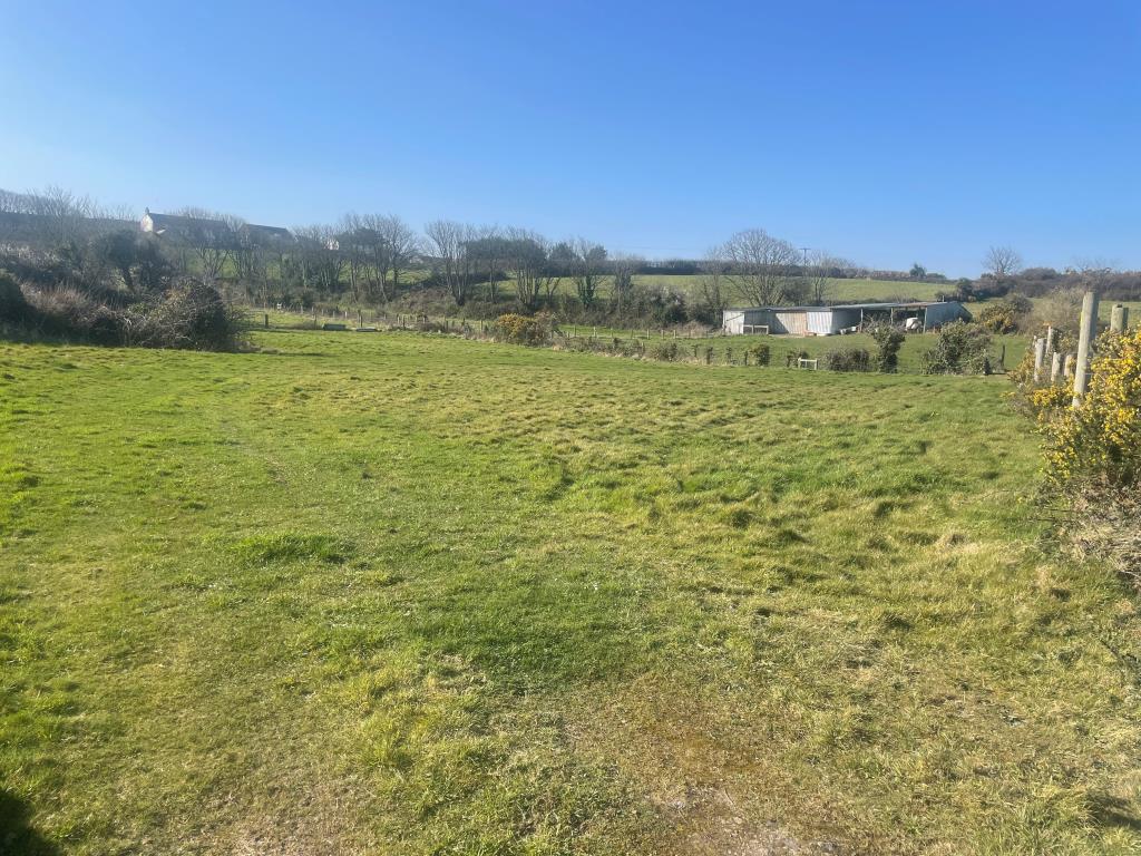 Lot: 9 - LAND WITH STABLE BLOCK AND BARN - View of land with stable block and barn in background